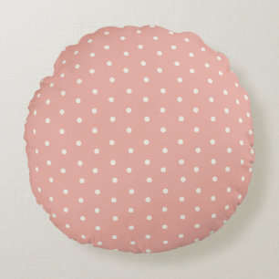 Baby polka dot patroon op roze achtergrond rond kussen