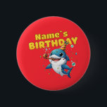 Baby Shark Ronde Button 5,7 Cm<br><div class="desc">Make a splash at your little one's birthday party with this adorable Baby Shark design! Featuring a cheerful blue shark wearing a festive party hat and blowing a noisemaker, surrounded by colorful confetti and bubbles. This vibrant, high-quality illustration is perfect for first birthdays, "One-derful" ocean-themed parties, or any toddler who...</div>