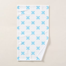 Babyblauwe kruisstiften op wit handdoek