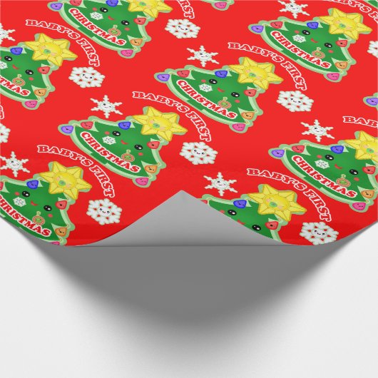 Baby's eerste kerstcadeautje met glanzende ompakke cadeaupapier (Hoek)