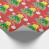 Baby's eerste kerstcadeautje met glanzende ompakke cadeaupapier (Hoek)