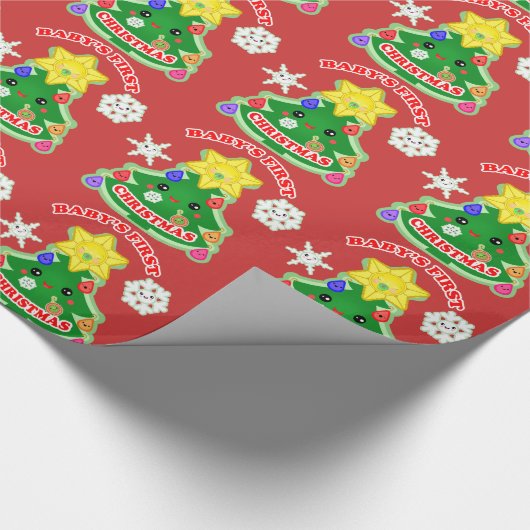 Baby's eerste kerstcadeautje met glanzende ompakke cadeaupapier (Hoek)