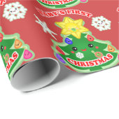 Baby's eerste kerstcadeautje met glanzende ompakke cadeaupapier (Rol Hoek)