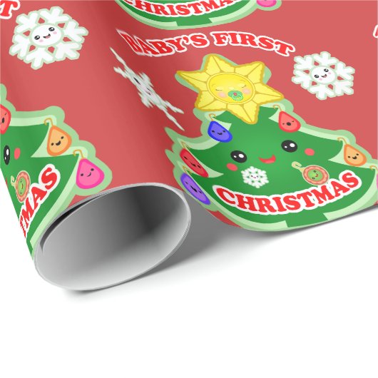 Baby's eerste kerstcadeautje met glanzende ompakke cadeaupapier (Rol Hoek)