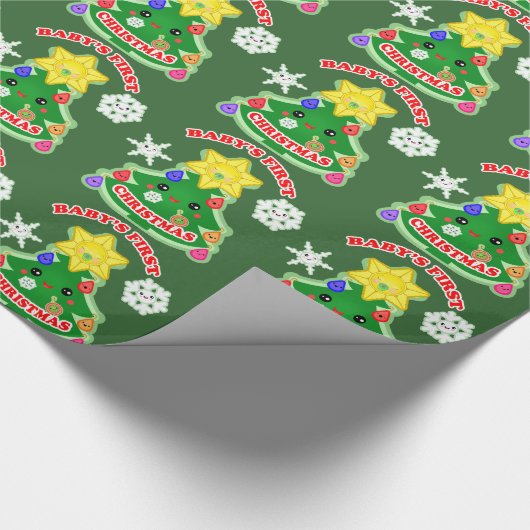 Baby's eerste kerstcadeautje met glanzende ompakke cadeaupapier (Hoek)