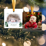Baby's eerste kersttong foto's keramisch ornament<br><div class="desc">Baby's eerste Kerstmis. Cute, Moderne, maar Robuuste Ornamenten voor kerstfeestdagen met schattige kleine bossen met roestachtige kerstbomen en vrolijk kerstfeest in moderne typografie. Voeg 2 van je favoriete foto's toe voor het perfecte ornament! Neem contact met ons op via cedarandstring@gmail.com als u hulp nodig hebt bij het ontwerp of de...</div>