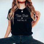 Bachelorette Party Team Bruid Gepersonaliseerde Br T-shirt<br><div class="desc">Verhoog je vrijgezellenfeeststijl met ons Team Bride Personalized Bridal T-Shirt in een chique en gedurfde donkere kleur, versierd met opvallende witte prints. Deze donkerkleurige shirten zijn ontworpen voor de bruid en haar team en voegen een vleugje verfijning toe aan uw feest, terwijl u tegelijkertijd een gevoel van plezier en eenheid...</div>