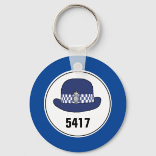 Badge-nummer. WPC van de politie. sleutelhanger
