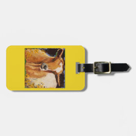 bagagelabel met witte en geelbruine geit