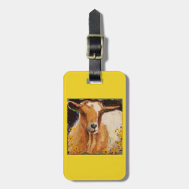 bagagelabel met witte en geelbruine geit