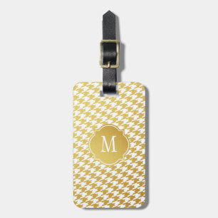 Bagagelabel voor gouden en witte geluidsmonogram