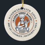 Bakery Store Pastry Chef Dessert Sweets Cake Baker Keramisch Ornament<br><div class="desc">This vintage-style circular logo features a cheerful female pastry chef wearing a traditional white chef's hat and apron. She is framed by a warm orange circular backdrop and holds a wire whisk in one hand and a flaky croissant in the other, symbolizing her culinary expertise. Below her, a blank, elegant...</div>