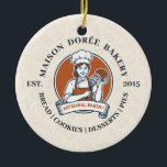 Bakery Store Pastry Chef Dessert Sweets Cake Baker Keramisch Ornament<br><div class="desc">This vintage-style circular logo features a cheerful female pastry chef wearing a traditional white chef's hat and apron. She is framed by a warm orange circular backdrop and holds a wire whisk in one hand and a flaky croissant in the other, symbolizing her culinary expertise. Below her, a blank, elegant...</div>
