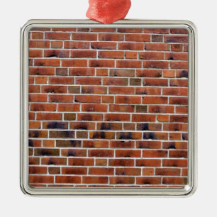 Bakstenen muur met verbindingen metalen ornament