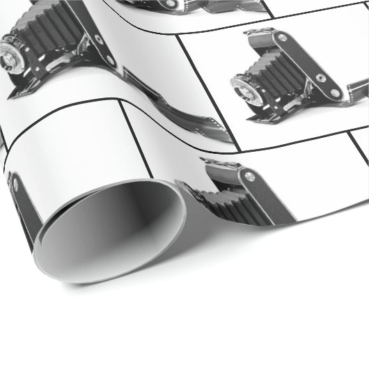  balgcamera op wit cadeaupapier (Rol Hoek)