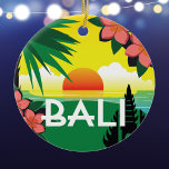 Bali Indonesia memento vintage-reisstijl Keramisch Ornament<br><div class="desc">Bali Indonesia ornament met een originele collage illustratie naar het voorbeeld van de traditionele reisstijl posters uit het verleden. Het helderkleurige tropische afbeelding omvat een zonsondergang over de oceaan, een gestileerde palmboom, frangipani-bloemen en een silhouet van een Balinese tempel. Het ornament neemt een prachtig voorbeeld van een bezoek aan Bali....</div>