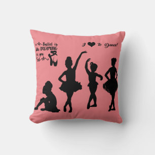 Ballerina gooit kussen in roze en zwart.