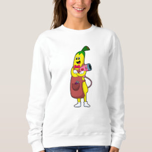 Banaan als hairdresser met luchtdroger trui
