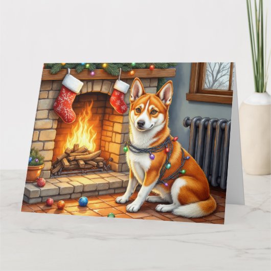 Basenji zit bij de open haard met kerstverlichting kaart (Voorkant)