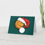 Basketbal Santa Pet Christmas Kaart<br><div class="desc">Een basketbal die een kerstbal draagt met een pet van hulst voor kerst. De achtergrond is groen,  maar de achtergrondkleur kan worden gewijzigd door op "Aanpassen" te klikken. Prettige feestdagen In de kaart staan de woorden "@",  ze kunnen ook worden aangepast.</div>