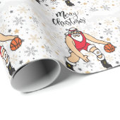 Basketball Santa Claus speelt met kerst Cadeaupapier (Rol Hoek)
