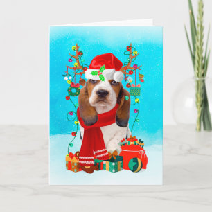Basset Hound in sneeuw met kerstcadeaus Kaart