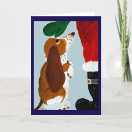Basset Puppy krijgt een huisdier van de Kerstman