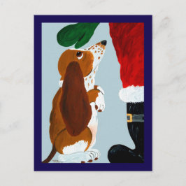 Basset Puppy krijgt een huisdier van de Kerstman Briefkaart
