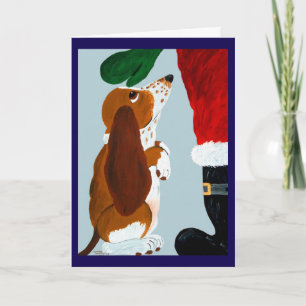 Basset Puppy krijgt een huisdier van de Kerstman Kaart