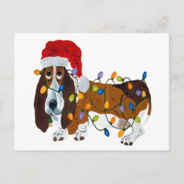 Basset verward in kerstverlichting feestdagenkaart