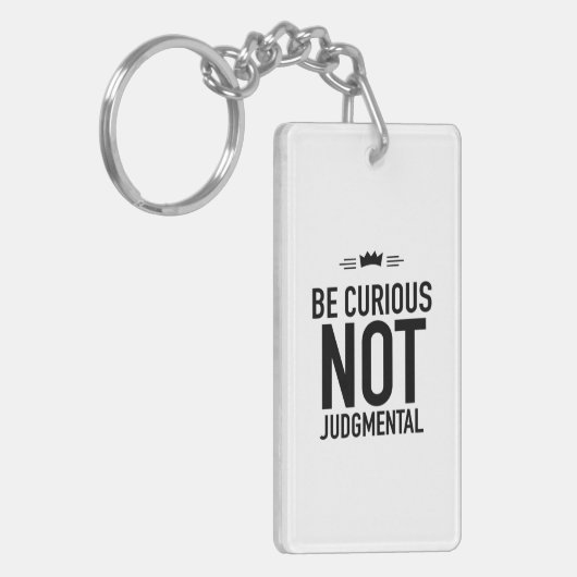 Be curious black sleutelhanger (Voorkant Links)
