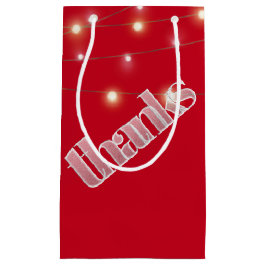 Bedankt in berijpte tekst met lichte tekenreeks klein cadeauzakje