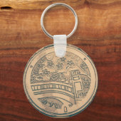 Bedekking van mangat en sleutelhanger van steenkoo (Voorkant)