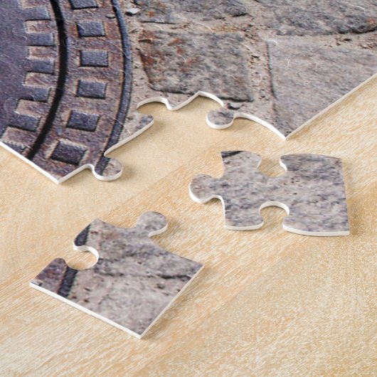 Bedekking van mangat en steenweg legpuzzel (Zijkant)