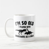 bedekt met dinosaurussen koffiemok (Links)