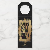 BEDRAAGT GOED MET ALLE Goudolie op zwart Flessenhanger (Voorkant)