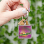 Beeld van asters gevormd in waterdruppels sleutelhanger (Hand)