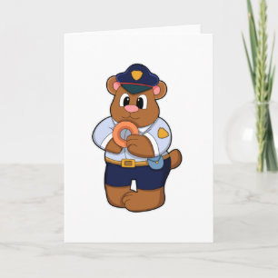 Beer als politieagent met politie-uniform en donut kaart
