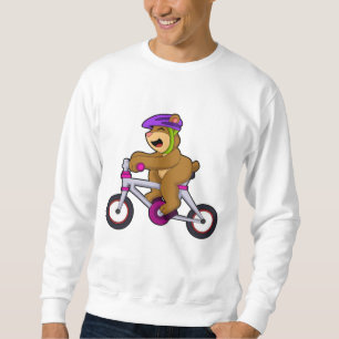Beer met fiets en helm trui