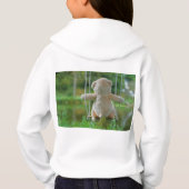 Beer op schommel vanaf de rug. (Achterkant)