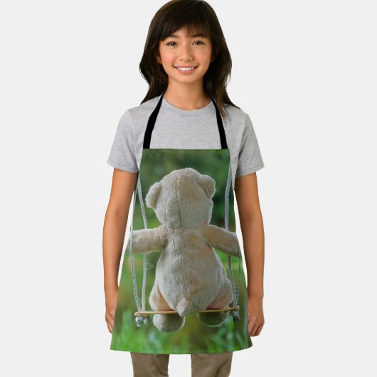 Beer op schommel vanaf de rug. schort (Insitu)