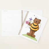 Beer verkleed als hommel met bloemen planner