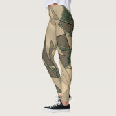 Beige driehoekige snede op de donkergroene achterg leggings (Links)