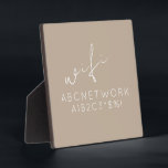 Beige WiFi-wachtwoordgebarenteken: Easel-standaard Fotoplaat<br><div class="desc">Houd uw gasten verbonden met dit stijlvolle en functionele WiFi-wachtwoordgeblindeerd. Het elegante beige ontwerp met een delicaat manuscriptdoopvont maakt het de perfecte toevoeging aan om het even welk huis of kantoor decor. Het 5.25x5.25-plaatje wordt geleverd met een handige eselstandaard voor eenvoudig beeldscherm. Schrijf gewoon uw WiFi-wachtwoord op het bord en...</div>