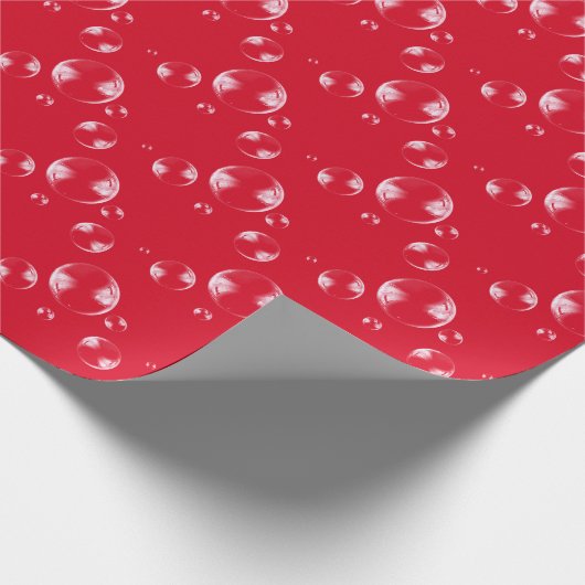 bellen op rode achtergrond cadeaupapier (Hoek)