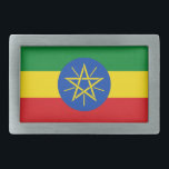Belt gesp met vlag van Ethiopië<br><div class="desc">Deze opvallende riemgesp met de vlag van Ethiopië is een gewaagd statement-stuk dat een patriottische toets toevoegt aan elke outfit. Met de levendige groene, gele en rode kleuren met het iconische embleem in het midden, is deze riemgesp perfect voor diegenen die trots zijn op de rijke geschiedenis en cultuur van...</div>