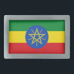 Belt gesp met vlag van Ethiopië<br><div class="desc">Deze opvallende riemgesp met de vlag van Ethiopië is een gewaagd statement-stuk dat een patriottische toets toevoegt aan elke outfit. Met de levendige groene, gele en rode kleuren met het iconische embleem in het midden, is deze riemgesp perfect voor diegenen die trots zijn op de rijke geschiedenis en cultuur van...</div>