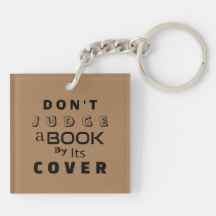 "Beoordeel een boek niet op zijn Hoesje" Lichtbrui Sleutelhanger
