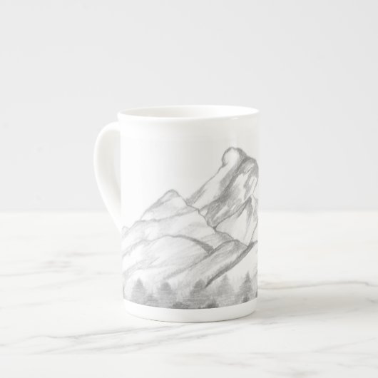 Bergtoppen geschetst met potlood op Latte mok (Links)