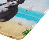 Berner Sennenhond op het strand Snijplank (Hoek)